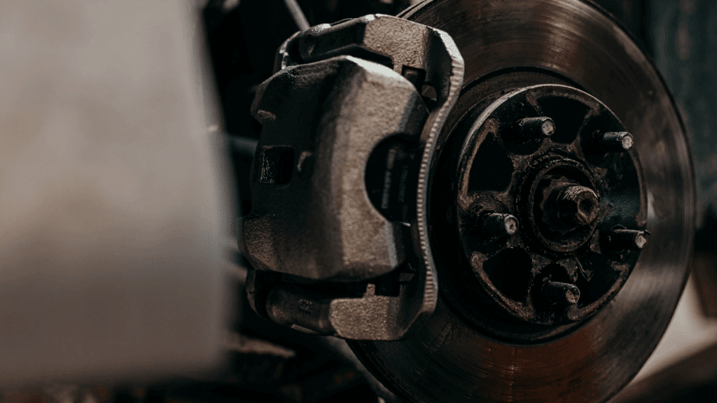 Brakes | Rowes Garage Inc. in Corinth, ME. Closeup image of a brake rotor and caliper.